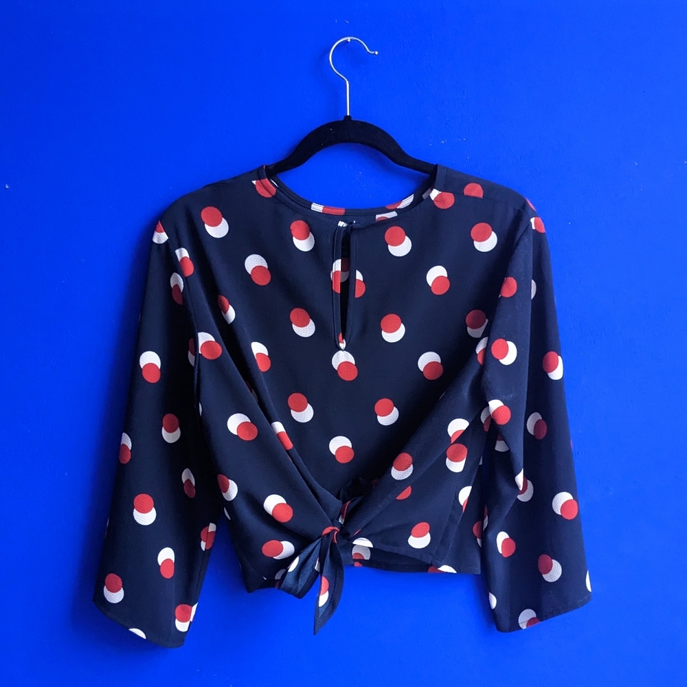 Navy red and white polka dot tie-back blouse